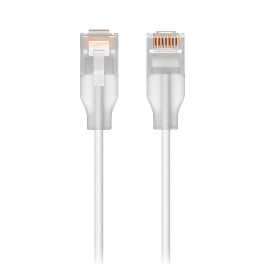 Close-up view of white patch cable showing flexible jacket and connector ends