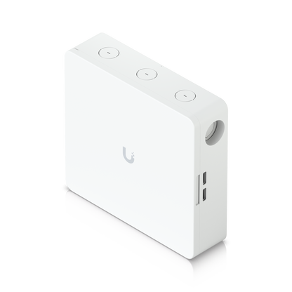 Top angled view of Ubiquiti EAH-8 hub showing circular knockouts and UniFi logo