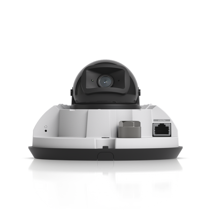UVC-G6-Dome-W front view with exposed lens, Ethernet port, and connection points visible